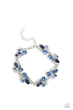 Load image into Gallery viewer, An eclectic collection of white and blue round rhinestones in varying sizes and marquise-cut gems in a blue shade cluster around the wrist in high-sheen silver frames. Patterned in an abstract manner, the clusters interlock together, emitting light from every faceted angle. Features an adjustable clasp closure.