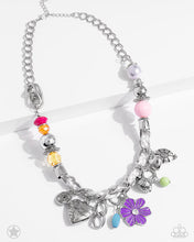 Load image into Gallery viewer, White cording is braided through a chunky silver chain. A unique variety of colorful charms decorate the piece including a delicate flower and a heart inscribed with the phrase "With All My Heart" on one side and a short bible verse on the other that reads, "Love the Lord thy God with all your heart. Luke 10:27." Features an adjustable clasp closure. Sold as one individual necklace. Includes one pair of matching earrings.