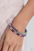 Load image into Gallery viewer, A collection of bright lavender and plum pearls, and shiny silver beads and accents are threaded along a wire that coils around the wrist, creating an eye-catching infinity wrap style bracelet.