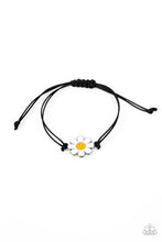 Load image into Gallery viewer, Held together and centered within soft black cording, a single daisy charm rests. Featuring a silver smiley face in its yellow center, this single flower provides a fashionably, minimalistic statement around the wrist. Features an adjustable sliding knot closure. Sold as one individual bracelet.
