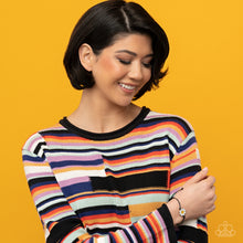 Load image into Gallery viewer, Held together and centered within soft black cording, a single daisy charm rests. Featuring a silver smiley face in its yellow center, this single flower provides a fashionably, minimalistic statement around the wrist. Features an adjustable sliding knot closure. Sold as one individual bracelet. Displayed on a Model.