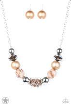 Load image into Gallery viewer, Warm beads in shades of brown and copper with reflective faceted edges and varying glazed finishes are offset by two shiny silver beads. An oblong bead studded with copper-toned rhinestones adds a dramatic accent. Features an adjustable clasp closure. Sold as one individual blockbuster necklace. Includes a matching set of earrings.