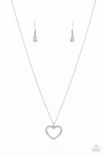 Load image into Gallery viewer, Encrusted in sparkly white rhinestones, an airy white heart frame swings from a dainty silver chain below the collar for a romantic look. Features an adjustable clasp closure. Sold as one individual necklace. Includes one pair of matching earrings.