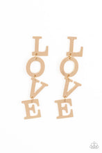 Load image into Gallery viewer, Gold letters with a lightly hammered sheen spell out the word "LOVE" as they vertically cascade down the ear in a flattering finish. Each of the letters are interconnected to one another giving the piece some whimsically playful movement. Earring attaches to a standard post fitting. Sold as one pair of post earrings.