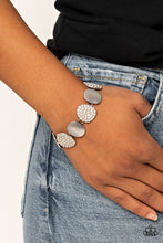 Load image into Gallery viewer, Featuring imperfect oval shapes, a series of delicately scratched and white rhinestone encrusted frames alternate around the wrist for a refined flair. Features an adjustable clasp closure.