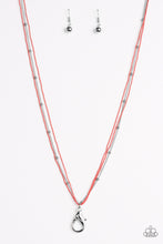 Load image into Gallery viewer, Painted in a refreshing coral finish, dainty ball-chains and a shimmery silver satellite chain drapes across the chest for a colorful industrial look. A lobster clasp hangs from the bottom of the design to allow a name badge or other item to be attached. Features an adjustable clasp closure. Sold as one individual lanyard. Includes one pair of matching earrings.