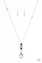 Load image into Gallery viewer, Infused with faceted silver beads, two polished black beads flank a silver bead encrusted in glittery white rhinestones for a regal look. A lobster clasp hangs from the bottom of the design to allow a name badge or other item to be attached. Features an adjustable clasp closure. Includes one pair of matching earrings.