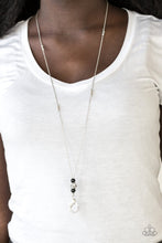 Load image into Gallery viewer, Infused with faceted silver beads, two polished black beads flank a silver bead encrusted in glittery white rhinestones for a regal look. A lobster clasp hangs from the bottom of the design to allow a name badge or other item to be attached. Features an adjustable clasp closure. Includes one pair of matching earrings.