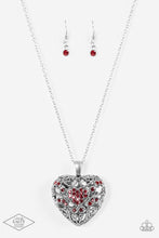 Load image into Gallery viewer, Vine-like filigree climbs the front of a locket inspired pendant for a vintage look. Featuring airy hearts on the back, the front of the dramatic pendant is sprinkled in glittery red rhinestones for a regal finish. Features an adjustable clasp closure. Sold as one individual necklace. Includes one pair of matching earrings.