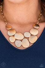 Load image into Gallery viewer, A collection of asymmetrical oval discs connect into a clustered pendant below the collar for a refined flair. Etched linear textures or white rhinestones adorn each disc, offering a gorgeous collision of texture, sheen, and sparkle. Features an adjustable clasp closure. Includes one pair of matching earrings.