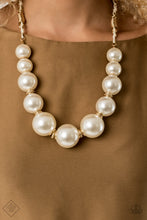 Load image into Gallery viewer, Separated by stacks of smooth and decorative gold rings, a collection of dramatically oversized white pearls are delicately hand-strung along an invisible wire that attaches to knotted strands of white cording for a classically handcrafted look. Features an adjustable clasp closure. Includes one pair of matching earrings.