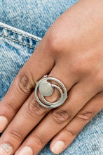 Load image into Gallery viewer, A solid silver disc and airy silver hoops eclipse across the finger, delicately coalescing into an edgy offset frame. Features a stretchy band for a flexible fit.