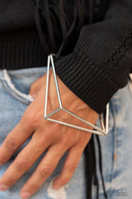Load image into Gallery viewer, Exaggerated silver triangle frames connect at their edges to create a geometric bangle with three-dimensional drama.