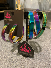 Load image into Gallery viewer, Futuristic Flavor Earrings - Radiating with hammered detail, an oil-spill finished hoop curls around the ear for a look ahead of its time. Earring attaches to a standard post fitting. Hoop measures approximately 1.75" in diameter. Industrial Imagination Bracelet - Burnished in a sleek oil spill finish, two sets of flat metal bands criss-cross over the wrist as they wrap into a lustrous cuff giving off an industrial vibe.