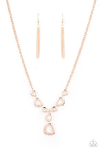 Load image into Gallery viewer, Irregular shaped rose gold rings connect to a rose gold chain as they make their way across the collar. Two rings dangle from the center for a stylish avant-garde fashion. Features an adjustable clasp closure. Includes one pair of matching earrings.