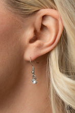 Load image into Gallery viewer, White rhinestone hanging from a silver fish hook earring.