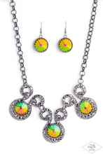 Load image into Gallery viewer, Three dramatically oversized oil spill rhinestones are nestled into three textured gunmetal fittings that are connected by oval gunmetal rings, creating a brilliant statement piece. Features an adjustable clasp closure. Due to its prismatic palette, color may vary. Sold as one individual necklace. Includes one pair of matching earrings.