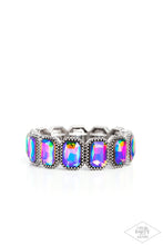 Load image into Gallery viewer, Oversized emerald style oil spill gems are encased in antiqued studded frames that are threaded along stretchy bands around the wrist, creating a smoldering centerpiece. Due to its prismatic palette, color may vary. Sold as one individual bracelet.
