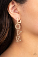 Load image into Gallery viewer, Gold letters with a lightly hammered sheen spell out the word "LOVE" as they vertically cascade down the ear in a flattering finish. Each of the letters are interconnected to one another giving the piece some whimsically playful movement. Earring attaches to a standard post fitting. Sold as one pair of post earrings.