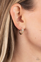 Load image into Gallery viewer, A shiny gold bar curls around the ear into a dainty hoop. Three gold stars gradually increase in size as they climb the curve of the hoop, with the biggest star emblazoned with white crystal-like rhinestones across its surface. Earring attaches to a standard post fitting. Hoop measures approximately 1/2" in diameter. Sold as one pair of hoop earrings.