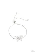 Load image into Gallery viewer, A deceptively simple silver butterfly charm glides along a silver snake chain for a whimsical flair along the wrist. Dainty, iridescent rhinestones encrust along the butterfly's body, creating an understated shimmer, while intricate, airy wings fold out from the sparkle, adding a 3D effect to the design. Features an adjustable sliding knot closure. Due to its prismatic palette, color may vary. Sold as one individual bracelet.