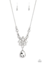 Load image into Gallery viewer, Adorned with a dainty silver chain, a twinkling collection of white, reflective teardrops, rhinestones and marquise-cut gems glitter down the chest. Hanging at the bottom of the glittery collection, an oversized teardrop gem swings for some eye-catching movement and shine. Features an adjustable clasp closure. Sold as one individual necklace. Includes one pair of matching earrings.