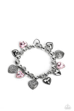 Load image into Gallery viewer, Decorative silver filigree, silver-studded, and pink gem heart charms swing from a collection of shiny silver beads, and silver beads with a dot motif. Threaded along an elastic stretchy band, the charming bracelet creates a timeless romantic centerpiece around the wrist. Sold as one individual bracelet.