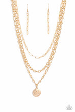 Load image into Gallery viewer, A trio of gold paperclip, classic, and oval link chains coalesces down the neckline for a monochromatic masterpiece. Strung on the lowermost oval link chain, a gold smiley face pendant, with a star mimicking a wink for one of its eyes, stands out and reflects light in every direction for a statement finish. Features an adjustable clasp closure. Sold as one individual necklace. Includes one pair of matching earrings.