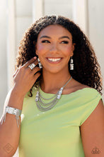 Load image into Gallery viewer, Necklace set including earrings, ring and bracelet displayed on a Model.