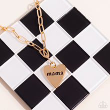 Load image into Gallery viewer, High-sheen gold ovals link down the chest drawing attention to the gold heart pendant at its bottom. Stamped with the word "mama" in its center, this monochromatic masterpiece gives off a simplistic, sentimental style. Features an adjustable clasp closure. Sold as one individual necklace. Includes one pair of matching earrings.