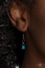 Load image into Gallery viewer, A collision of mismatched gunmetal chains gives way to a studded gunmetal pendant that has been encrusted in glittery blue UV rhinestones. The result is a gritty, industrial design with endless attitude. Features an adjustable clasp closure. Sold as one individual necklace. Includes one pair of matching earrings.