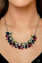 Load image into Gallery viewer, Featuring pronged silver fittings, a sparkly series of marquise-cut rhinestones in varying sizes and opacities are splashed in hues of purple, blue, light blue, baby pink, pink, and green as they fan out below the collar for a vibrant statement. Fuchsia and white round gems in varying sizes sporadically cluster around the marquise-cuts for additional shimmer in the geometric, refined display. Sold as one individual necklace. Includes one pair of matching earrings.