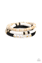 Load image into Gallery viewer, Varying in shades, tan, black, and white clay discs pair with shiny gold disc beads and accents creating layers across the wrist. Featured on one of the bracelets, white beads stamped with gold lettering spell out the word "wish," while gold heart silhouettes stamped in the same white beads frame the inspirational phrase for a wistful finish. Sold as one set of three bracelets.