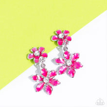 Load image into Gallery viewer, A hot pink transparent flower with pinched petals blooms around a glittery white gem center. The large flower swings from a second transparent hot pink flower, featuring a smaller size with fanned-out petals encircling a glittery white gem center. The elements combine to create a whimsical lure rich in character. Earring attaches to a standard clip-on fitting. Sold as one pair of clip-on earrings.