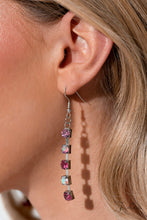 Load image into Gallery viewer, Row after row of glittery pink rhinestones fall along flexible bands of silver, encircling the neck in stunning shimmer. The top row showcases a fierce shade of fuchsia, which contrasts beautifully with the iridescent gems that layer below. Smaller fuchsia gems line the middle tier, playfully twinkling against the second row of iridescent gems that follows. Finally, a strand of light pink rhinestones lines the bottom row, elevating the colorful collar to sparkling new heights.