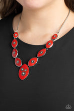 Load image into Gallery viewer, Featuring vibrant red paint, a collection of silver marquise-shaped frames gradually increase in size as they taper below the collar in a timeless fashion on a silver snake chain. Each frame is embossed with a delicate silver flower with a white rhinestone center, with the centermost pendant featuring three flowers, creating a glamorous array of whimsicality. Features an adjustable clasp closure. Sold as one individual necklace. Includes one pair of matching earrings.