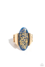 Load image into Gallery viewer, Encased in an exaggerated, sleek gold frame, an elongated glassy blue oval with an opalescent finish rests atop the finger. Flecks of gold shimmer sporadically dot the inside of the glassy bead for a refined, glitzy finish. Features a stretchy band for a flexible fit. Featured inside The Preview at Made for More! Sold as one individual ring.