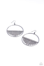 Load image into Gallery viewer, A curtain of white rhinestones is stretched between the edges of a skinny, oversized gunmetal hoop, creating a shimmering display. The rhinestones taper towards the center as they sway and cascade, adding sparkly movement for a fierce industrial finish. Earring attaches to a standard fishhook fitting. Sold as one pair of earrings.
