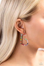 Load image into Gallery viewer, A simple silver hoop of silver curves around the ear into a heart-shaped frame. Featured on the heart frame, multicolored stripes alternate with the high-sheen finish of the silver for a lasting impression. Earring attaches to a standard post fitting. Hoop measures approximately 1 3/4" in diameter. Sold as one pair of hoop earrings.