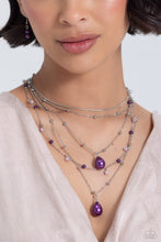 Load image into Gallery viewer, Dainty lavender pearls, silver beads, and plum pearls trickle along an assortment of silver chains, creating shimmery layers across the chest. Two exaggerated plum pearly teardrops cascade from the bottom of the design for additional eye-catching detail. Features an adjustable clasp closure. Includes one pair of matching earrings.