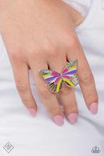 Load image into Gallery viewer, Featuring Fuchsia Fedora, Love Bird, purple, and baby pink details, an oversized, silver butterfly flutters atop airy silver bands. Dainty multicolored and iridescent rhinestones dust the upper curves of the silver wings for a dazzling centerpiece atop the finger. Features a stretchy band for a flexible fit. Due to its prismatic palette, color may vary. Sold as one individual ring.