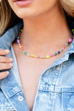 Load image into Gallery viewer, Infused on an invisible wire, an assortment of multicolored beads, acrylics, and chiseled stones alternating with dainty silver rods coalesce around the neckline for a youthful pop of color. Features an adjustable clasp closure. As the stone elements in this piece are natural, some color variation is normal. Sold as one individual necklace. Includes one pair of matching earrings.
