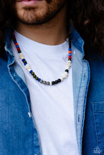 Load image into Gallery viewer, Colorful sections of multicolored beads and gray crackle bead accents adorn a strand of chiseled and round white marbled stones and stone beads, creating an earthy compliment below the collar. Features an adjustable clasp closure. As the stone elements in this piece are natural, some color variation is normal. Sold as one individual necklace.