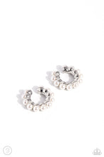 Load image into Gallery viewer, Pressed in a scalloped silver fitting, white pearls wrap around the ear for a refined fashion. Features a smooth surface for sliding ability to desired position on the ear. Due to its structure, adjusting capability is limited. Cuff measures approximately 3/4" in diameter. Sold as one pair of cuff earrings.