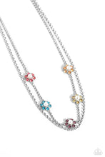 Load image into Gallery viewer, Featuring silver square fittings, white rhinestones cascade into two layers below the collar adding glitzy movement to the sparkling centerpiece. Infused along the uppermost chain, a glitzy collection of pearl-dotted flowers with rose, blue, amethyst, yellow, and peachy rhinestone petals creates a splash of whimsical color. Features an adjustable clasp closure. Featured inside The Preview at Made for More! Sold as one individual necklace. Includes one pair of matching earrings.
