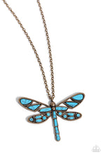 Load image into Gallery viewer, Featuring a classic brass chain, various cuts of turquoise stone are passed into an oversized, airy brass dragonfly pendant for a rustically earthy centerpiece. Features an adjustable clasp closure. As the stone elements in this piece are natural, some color variation is normal. Sold as one individual necklace. Includes one pair of matching earrings.