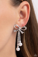 Load image into Gallery viewer, Adorned in sparkling iridescent rhinestones, high-sheen bands of silver curl and loop into a stunning bow charm, creating a classy statement at the ear. Iridescent rhinestones encased in scalloped silver fittings, featuring white pearls that slowly increase in size dangle from the bow charm adding a refined tassel to the stunning display. Earring attaches to a standard post fitting. Sold as one pair of post earrings.