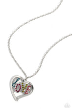 Load image into Gallery viewer, Featuring blue, fuchsia, olive, and rose rhinestones, the word "LOVE" floats inside an oversized, airy heart-shaped frame as it sways from a lengthened silver chain for a Valentine's-inspired centerpiece. Features an adjustable clasp closure. Sold as one individual necklace. Includes one pair of matching earrings.