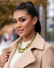 Load image into Gallery viewer, Varying in shape and opacity, a refreshing collection of sparkle-infused green beads layer below the collar for a boldly colorful look. Accents of faceted gold beads and gold studs are infused throughout the design for a subtle touch of additional sheen. Features an adjustable clasp closure. Sold as one individual necklace. Includes one pair of matching earrings.