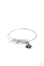Load image into Gallery viewer, The word "Beyoutiful" is stamped across a thick plate of silver, with the "you" in a playful purple font. A textured, silver lotus flower charm gathers at the side of the inspirational centerpiece as it connects to a skinny silver bar that wraps around the wrist. Features a hook and eye closure. Sold as one individual bracelet.